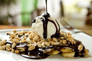 Chocolate crepe and vanilla ice cream, French food, banana and peanuts toppings