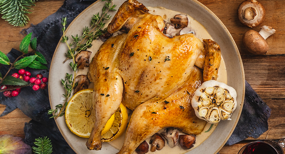 traditional roast chicken served with white wine mushroom cream sauce and herbs